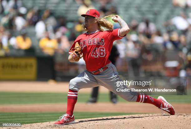 John Lamb of the Los Angeles Angels of Anaheim pitches against the Oakland Athletics in the bottom of the second inning at the Oakland Alameda...