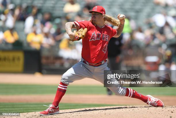 John Lamb of the Los Angeles Angels of Anaheim pitches against the Oakland Athletics in the bottom of the second inning at the Oakland Alameda...