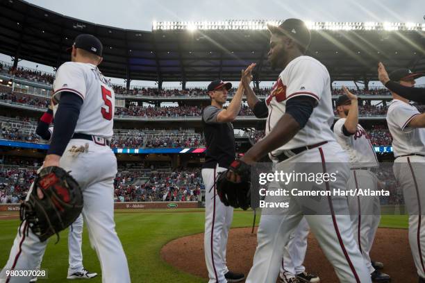 Arodys Vizcaino shakes hands with Atlanta Braves players following their win against the San Diego Padres at SunTrust Park on June 16 in Atlanta,...