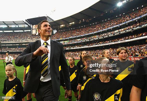 Matthew Richardson of the Tigers waves to fans during a farewell lap before the round one AFL match between the Richmond Tigers and Carlton Blues at...