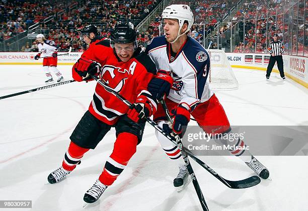 Zach Parise of the New Jersey Devils skates against Marc Methot of the Columbus Blue Jackets at the Prudential Center on March 23, 2010 in Newark,...