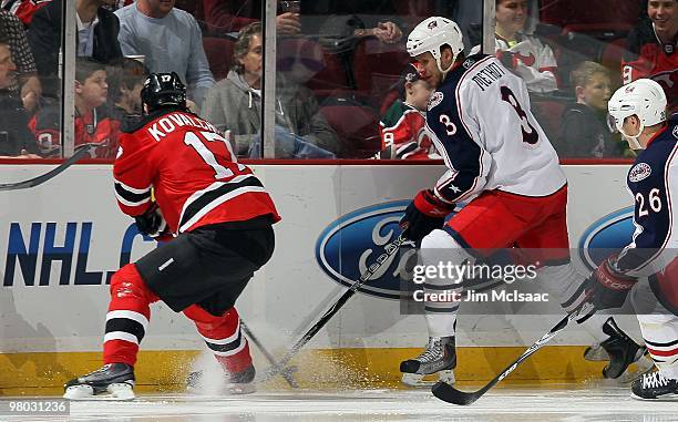 Marc Methot of the Columbus Blue Jackets skates against Ilya Kovalchuk of the New Jersey Devils at the Prudential Center on March 23, 2010 in Newark,...