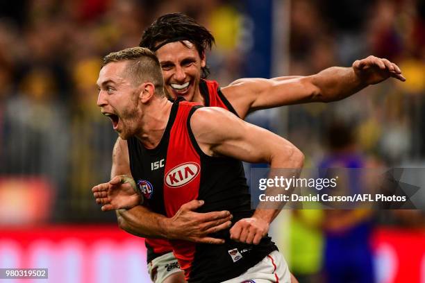 Devon Smith of the Bombers celebrates a goal during the 2018 AFL round 14 match between the West Coast Eagles and the Essendon Bombers at Optus...