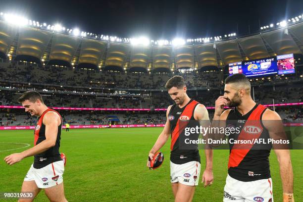 Conor McKenna, Adam Saad and David Myers of the Bombers celebrate the win during the 2018 AFL round 14 match between the West Coast Eagles and the...