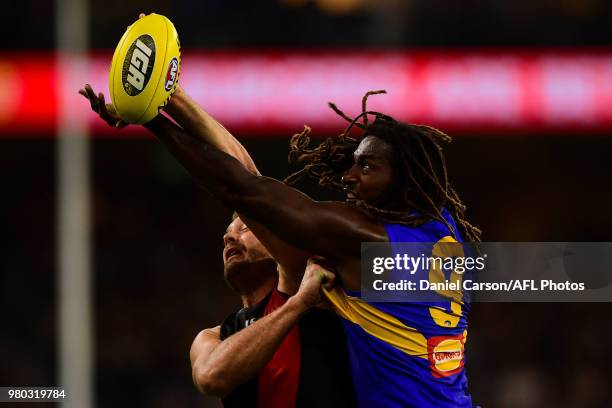 Tom Bellchambers of the Bombers contests a boundary throw in against Nic Naitanui of the Eagles during the 2018 AFL round 14 match between the West...