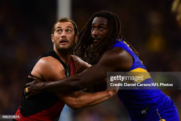 Tom Bellchambers of the Bombers contests a boundary throw in against Nic Naitanui of the Eagles during the 2018 AFL round 14 match between the West...