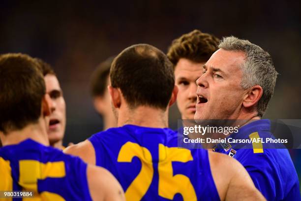 Adam Simpson, coach of the Eagles addresses the team at quarter time during the 2018 AFL round 14 match between the West Coast Eagles and the...