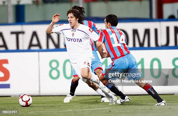 Antonio Bellusci of Catania Calcio battles for the ball with Stevan Jovetic of ACF Fiorentina during the Serie A match between Catania Calcio and ACF...