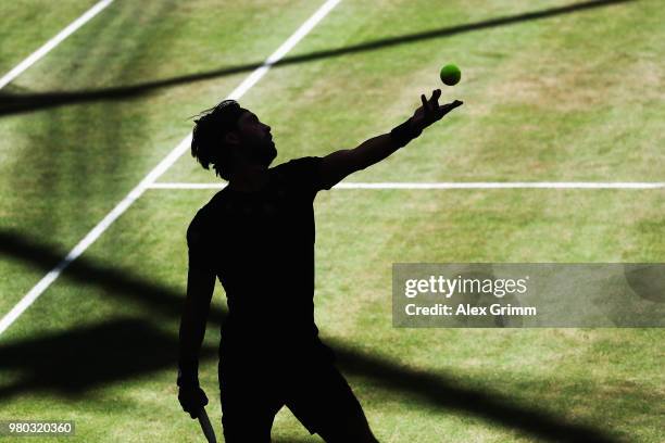 Nikoloz Basilashvili of Georgia serves the ball to Borna Coric of Croatia during their round of 16 match on during day 4 of the Gerry Weber Open at...