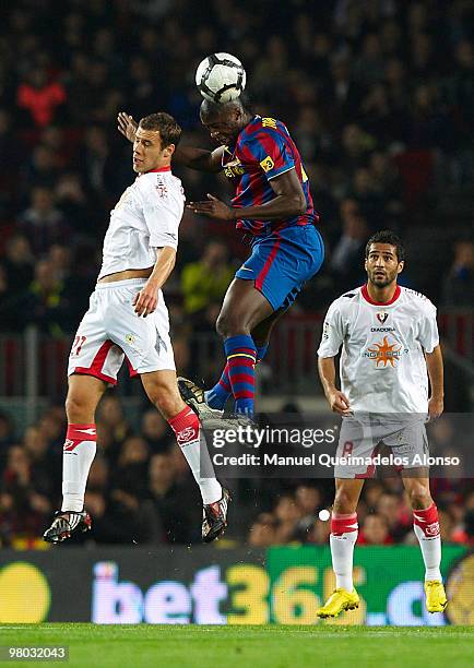 Toure Yaya of FC Barcelona competes for the ball with Krisztian Vad�cz of Osasuna during the La Liga match between Barcelona and Osasuna at the Camp...