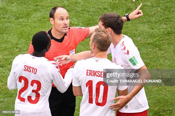 Spanish referee Antonio Mateu Lahoz speaks to Denmark's players during the Russia 2018 World Cup Group C football match between Denmark and Australia...