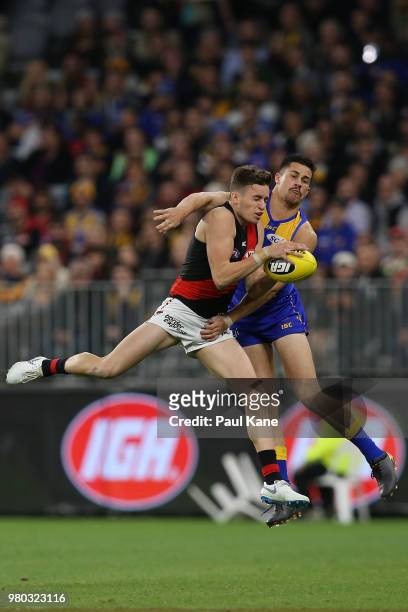 Orazio Fantasia of the Bombers marks the ball against Liam Duggan of the Eagles during the round 14 AFL match between the West Coast Eagles and the...