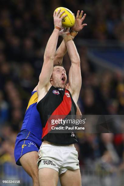 Shaun McKernan of the Bombers contests for a mark against Will Schofield of the Eagles during the round 14 AFL match between the West Coast Eagles...