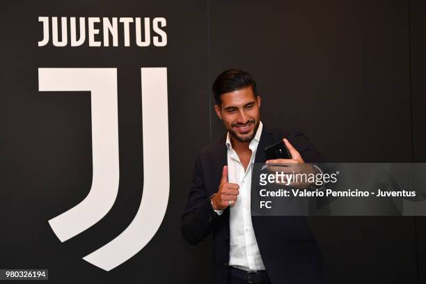 Emre Can poses as he signs a contract with Juventus at Juventus headquarters on June 21, 2018 in Turin, Italy.
