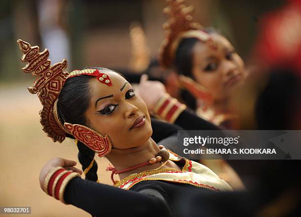 Sri Lankan dancers perform a traditional low country Gajaba Vannama dance routine to foreign visitors at the Udawalawe nature reserve in the southern...