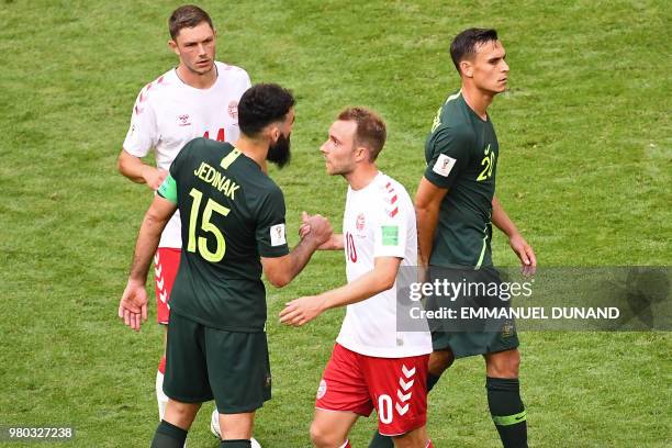 Australia's midfielder Mile Jedinak shakes hands with Denmark's midfielder Christian Eriksen after the Russia 2018 World Cup Group C football match...