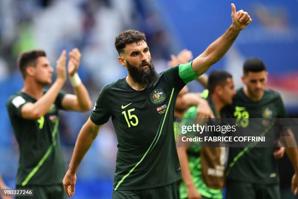 Australia's midfielder Mile Jedinak salutes the crowd after the final whistle during the Russia 2018 World Cup Group C football match between Denmark...