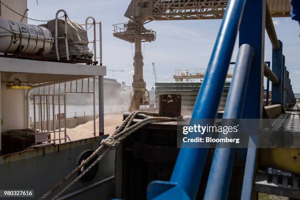 Wheat grain is fed into the hull of cargo ship Kelly C at the Lecureur SA cereal plant on the banks of the River Seine at the Port of Rouen in Val de...