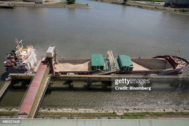 Wheat grain is fed into the hull of cargo ship Kelly C at the Lecureur SA cereal plant on the banks of the River Seine at the Port of Rouen in Val de...