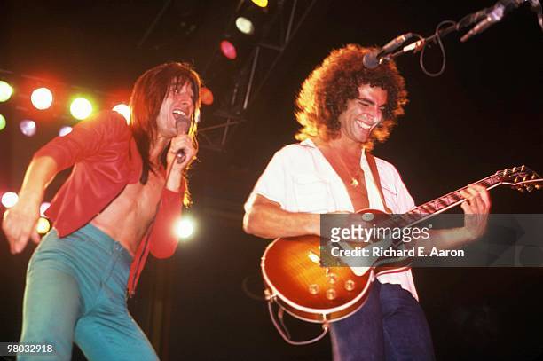 Steve Perry and Neal Schon of Journey perform on stage in New York in 1980.