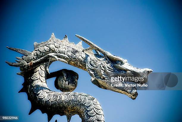 chinese  dragon statue  - costa dorada stock pictures, royalty-free photos & images