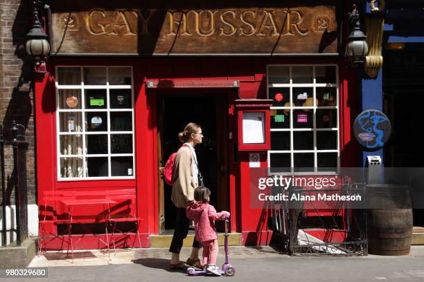 Members of the public walk past the Hungarian restaurant, 'Gay Hussar' in Soho on June 21, 2018 in London, England. The restaurant is due to close...