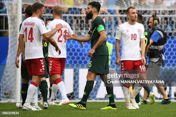 Australia's midfielder Mile Jedinak shakes hands with Denmark's defender Henrik Dalsgaard after the final whistle during the Russia 2018 World Cup...