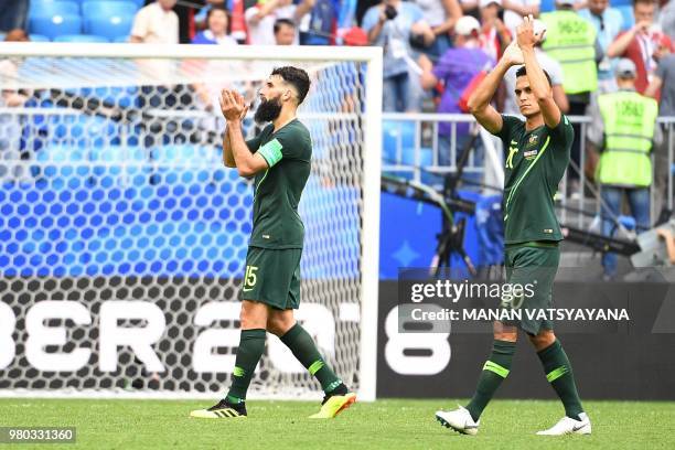 Australia's midfielder Mile Jedinak and Australia's defender Trent Sainsbury react during the Russia 2018 World Cup Group C football match between...