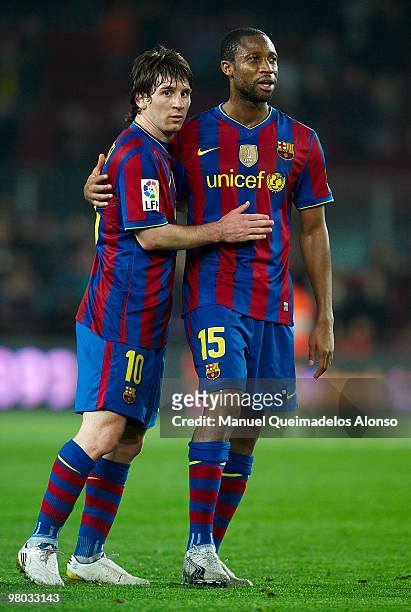 Seydou Keita of FC Barcelona embrances Lionel Messi at the end of the match after the La Liga match between Barcelona and Osasuna at the Camp Nou...