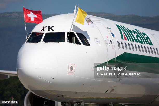 The aircraft of Pope Francis with the flags of Switzerland and the Vatican is pictured after landing at the airport upon his arrival for a one-day...