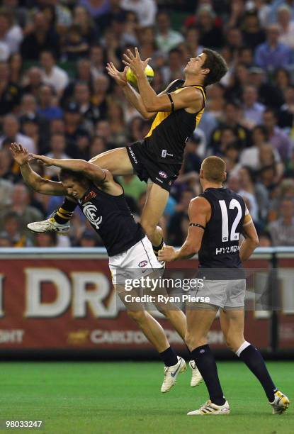 Trent Cotchin of the Tigers takes a big mark during the round one AFL match between the Richmond Tigers and Carlton Blues at the Melbourne Cricket...