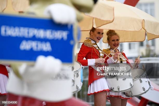 Majorettes stand with their drums outside the stadium before the Russia 2018 World Cup Group C football match between France and Peru at the...