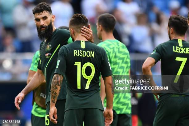 Australia's midfielder Mile Jedinak greets Australia's defender Joshua Risdon after the final whistle during the Russia 2018 World Cup Group C...