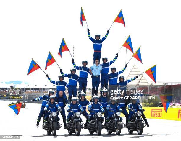 French motorcycle gendarmes perform at the Circuit Paul Ricard in Le Castellet, southern France, on June 21 a few days ahead of the Formula One Grand...