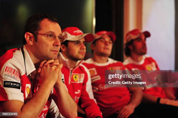 Ferrari Team Principal Stefano Domenicali listens alongside Ferrari drivers Felipe Massa of Brazil, Giancarlo Fisichella of Italy and Fernando Alonso...