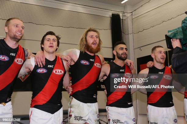 Dyson Heppell of the Bombers sings the team song after the teams win during the round 14 AFL match between the West Coast Eagles and the Essendon...