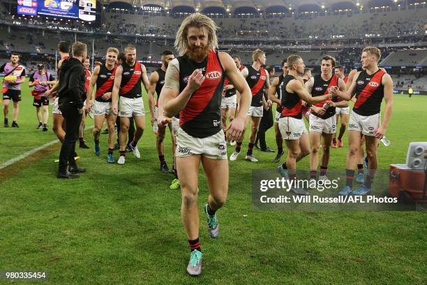 Dyson Heppell of the Bombers leads the team off the field after the win during the round 14 AFL match between the West Coast Eagles and the Essendon...