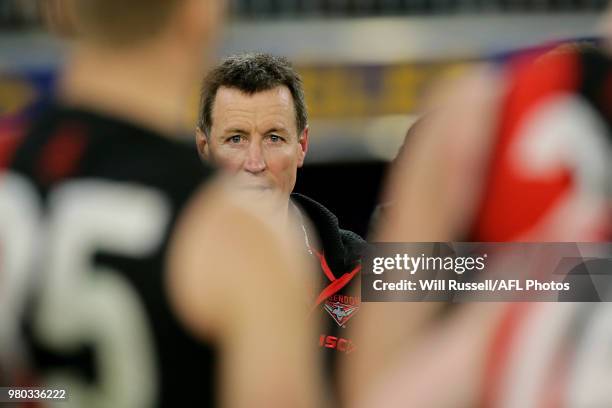 John Worsfold, Senior Coach of the Bombers, addresses the players at the three-quarter time break during the round 14 AFL match between the West...