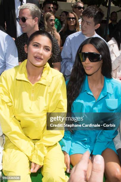 Kylie Jenner and Kim Kardashian attend the Louis Vuitton Menswear Spring/Summer 2019 show as part of Paris Fashion Week Week on June 21, 2018 in...