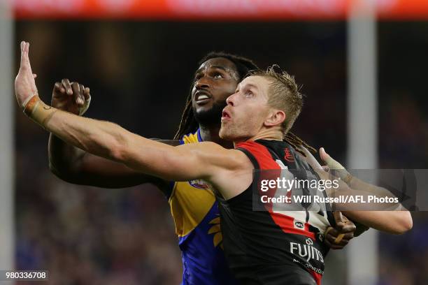 Shaun McKernan of the Bombers contests a ruck with Nic Naitanui of the Eagles during the round 14 AFL match between the West Coast Eagles and the...