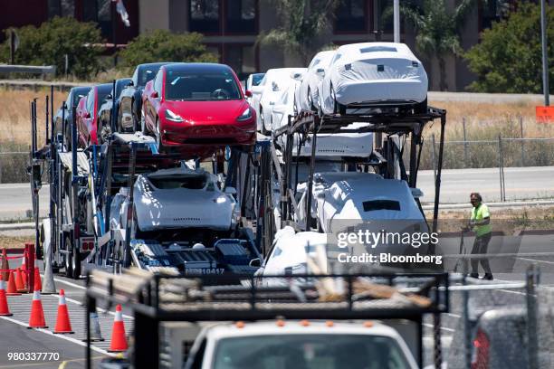 Tesla Inc. Vehicles are loaded onto a truck for transport at the company's manufacturing facility in Fremont, California, U.S., on Wednesday, June...