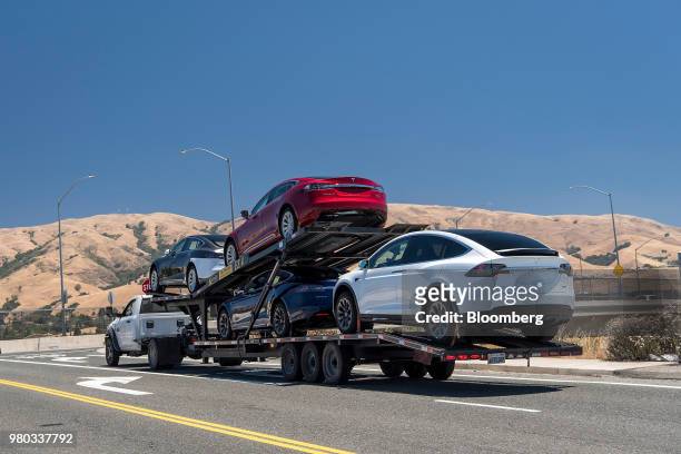 Tesla Inc. Vehicles are transported on a truck after leaving the company's manufacturing facility in Fremont, California, U.S., on Wednesday, June...