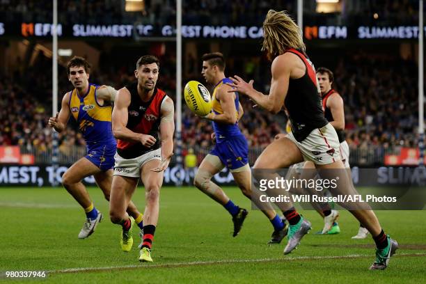 David Myers of the Bombers handpasses the ball during the round 14 AFL match between the West Coast Eagles and the Essendon Bombers at Optus Stadium...