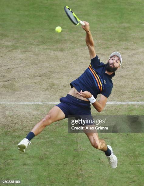 Benoit Paire of France plays a smash to Roger Federer of Switzerland during their round of 16 match on day 4 of the Gerry Weber Open at Gerry Weber...