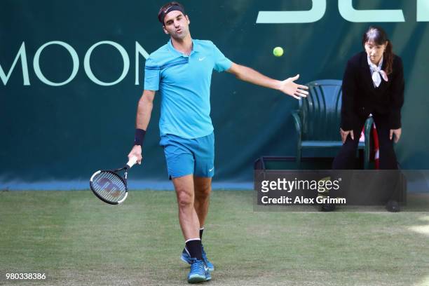 Roger Federer of Switzerland reacts during his round of 16 match against Benoit Paire of France on day 4 of the Gerry Weber Open at Gerry Weber...