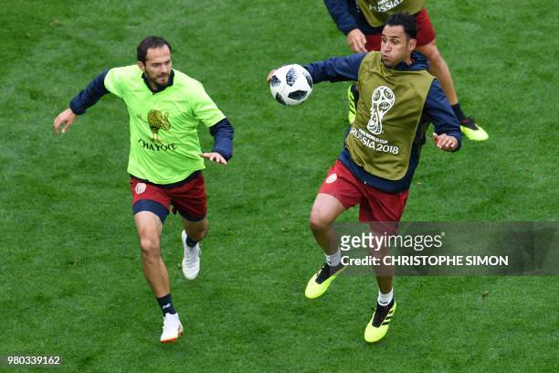 Costa Rica's goalkeeper Keylor Navas and Costa Rica's forward Marco Urena attend a training session at the Saint Petersburg stadium in Saint...