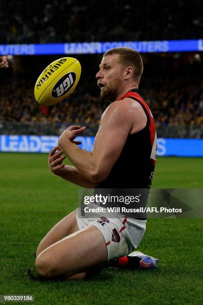 Jake Stringer of the Bombers fumbles the ball during the round 14 AFL match between the West Coast Eagles and the Essendon Bombers at Optus Stadium...