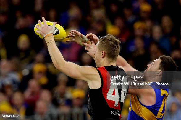 Shaun McKernan of the Bombers marks the ball during the round 14 AFL match between the West Coast Eagles and the Essendon Bombers at Optus Stadium on...