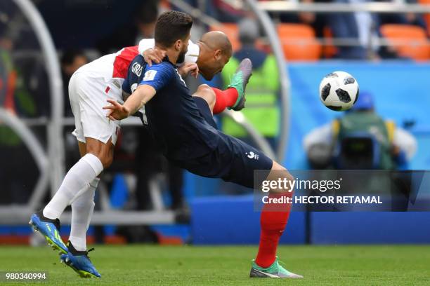 France's forward Olivier Giroud and Peru's defender Alberto Rodriguez compete for the ball during the Russia 2018 World Cup Group C football match...