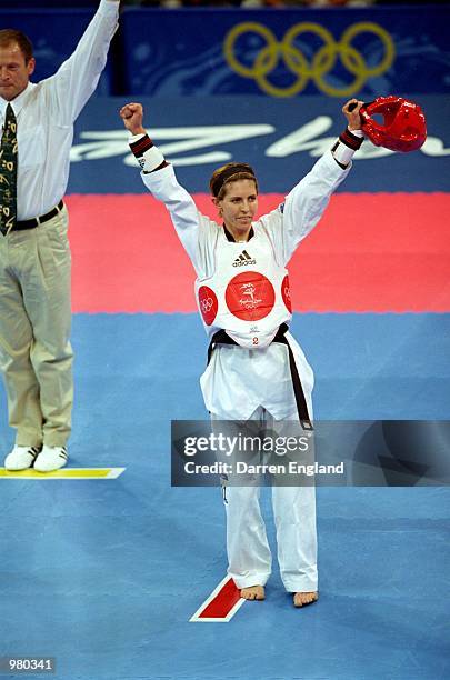 Lauren Burns of Australia celebrates winning the gold medal in the Women's 49kg Taekwondo Final held at the State Sports Centre during the Sydney...